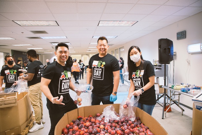 Three volunteers at Feeding San Diego's distribution center