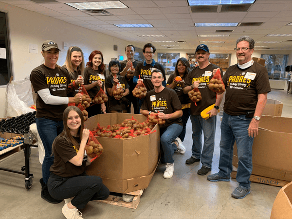 Group of Padres employees volunteer at Feeding San Diego's volunteer center
