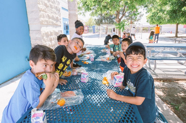 Kids eating lunch at Boys and Girls Club San Marcos as part of the summer meal program