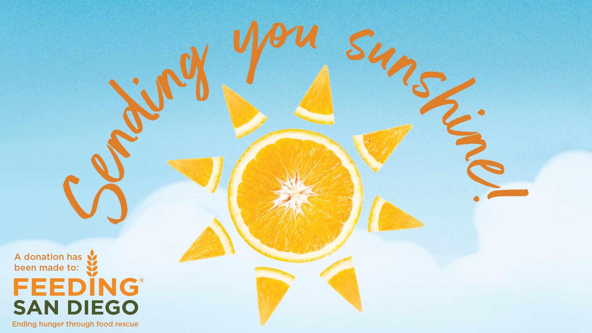 An e-card with a photo of an orange cut to look like a sun and text that reads Sending you sunshine! A donation has been made to Feeding San Diego