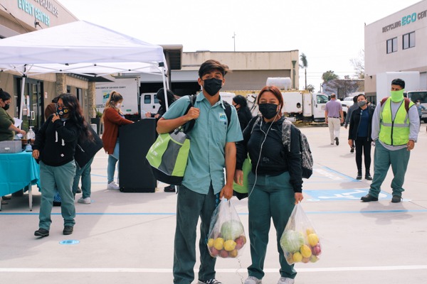 Couple collects food at Feeding San Diego distribution in partnership with Urban Corps