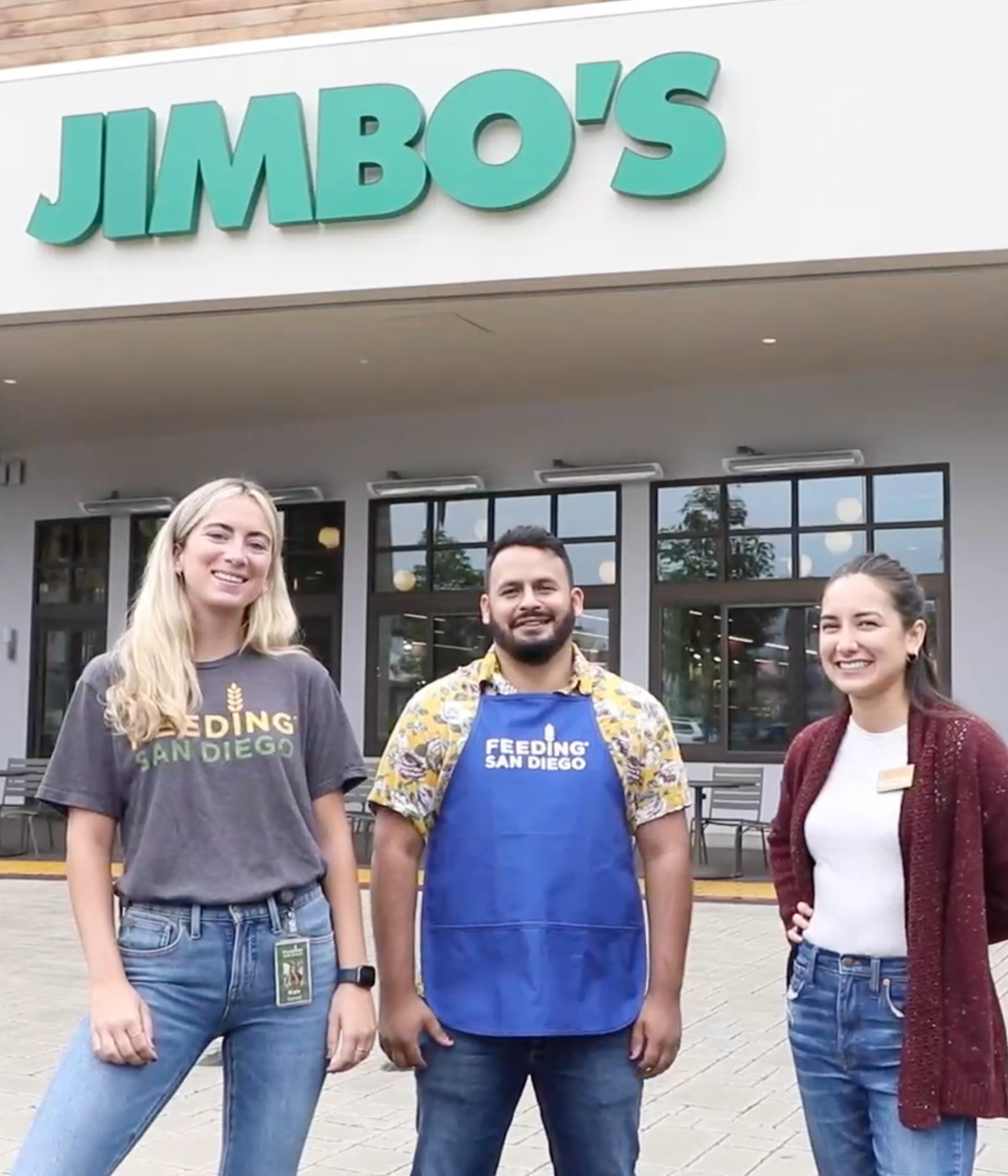 Feeding San Diego and Jimbos team stand outside one of Jimbo's stores