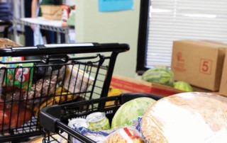 line of shopping carts with food at the Fallbrook Food Pantry