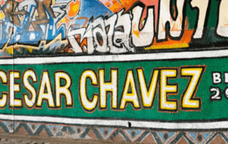 Street art in Barrio Logan showing the Cesar Chavez street sign