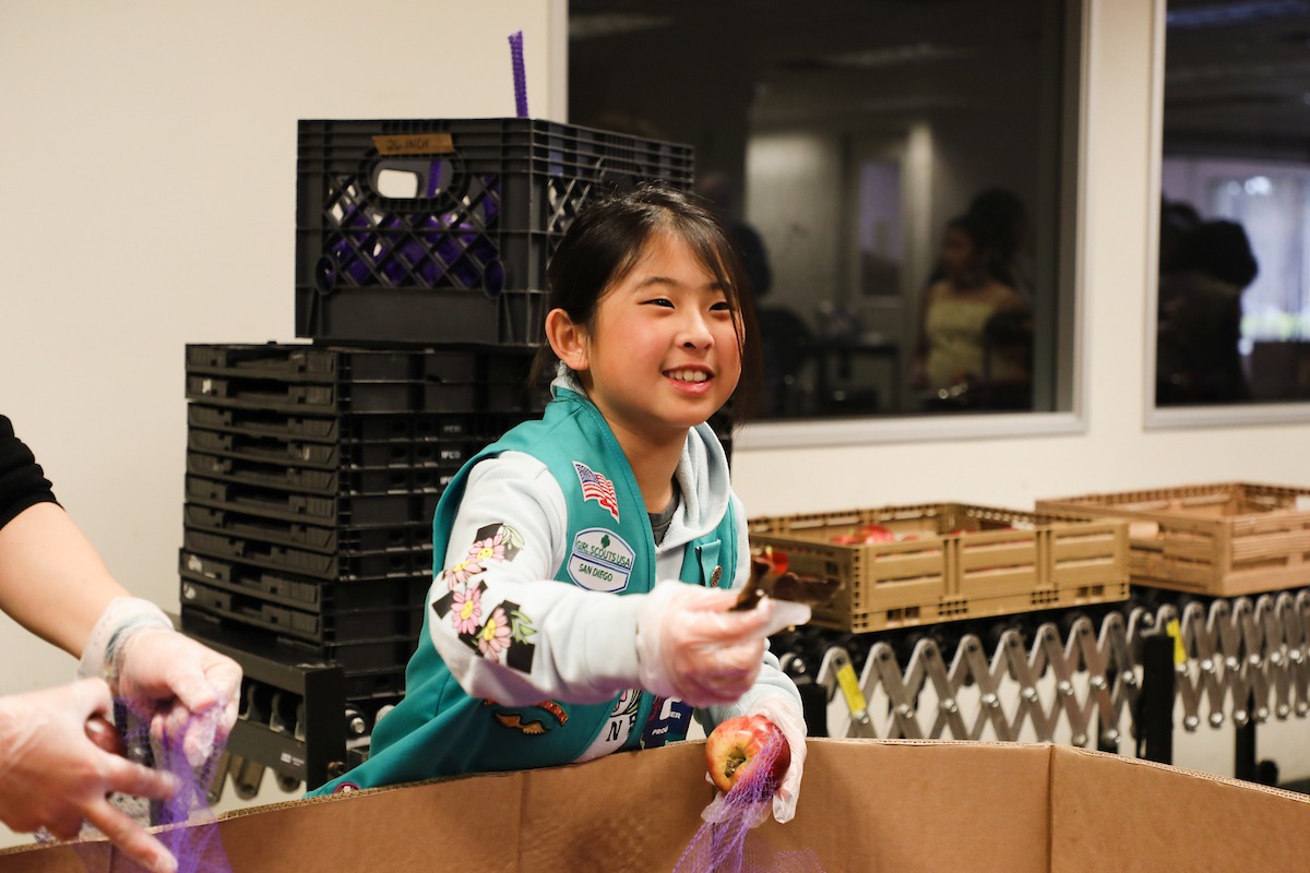Girl scout in Feeding San Diego volunteer center