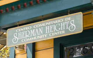 A sign which says "Centro Comunitaro De Sherman Heights Community Center"
