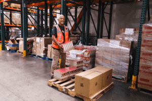 Volunteer in warehouse with pallet jack