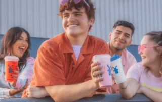 Group of friends holding Dutch Bros drinks