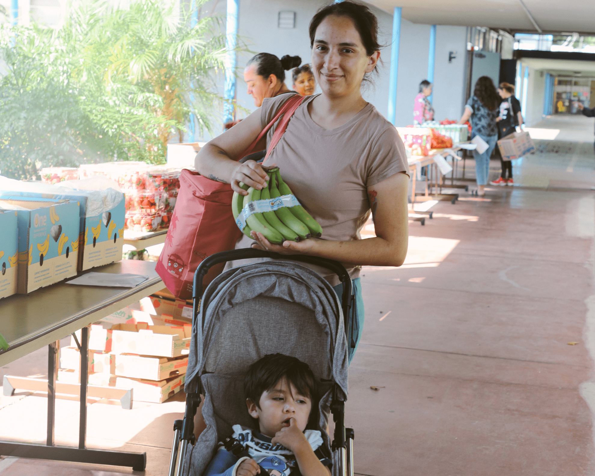 Denise IBCS School Pantry Woman holding fresh cauliflower