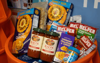 Various foods in an orange bin