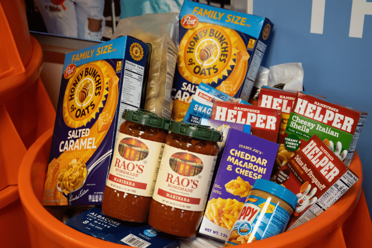 Various foods in an orange bin