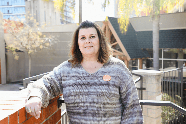 A woman standing on a balcony
