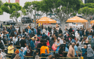 A line of people at Feeding San Diego waiting to receive food
