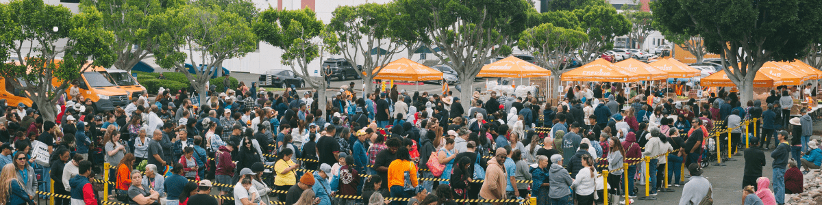 A line of people at Feeding San Diego waiting to receive food